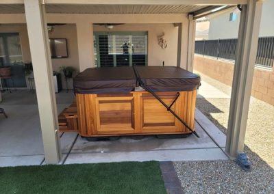 covered hot tub arctic spas in red cedar cabinet
